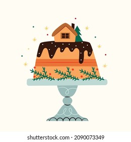 Christmas cake in chocolate decorated with a gingerbread house. Traditional Christmas sweets.