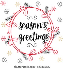Christmas calligraphy Season's Greetings. Hand drawn brush lettering in red, black colors, floral wreath, snow flakes. Greeting card template, banner.