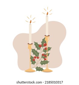 Christmas candles decoration with holly plant