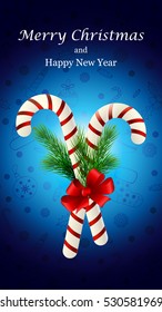 Christmas candy cane decorated with a bow and Christmas tree branches