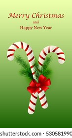 Christmas candy cane decorated with a bow and Christmas tree branches