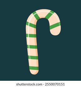 Christmas candy cane with green stripes isolated on dark background. 