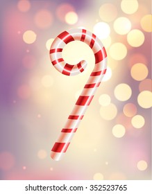 Christmas candy cane on beautiful blurred background - vector illustration