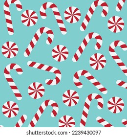 christmas candy cane and peppermint candy pattern on green background