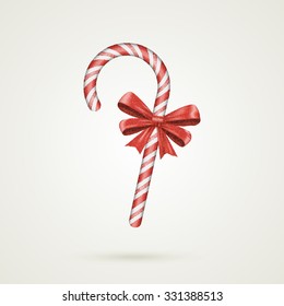Christmas Candy Cane with red bow isolated on white background. Realistic circle style. Happy holidays and merry celebrations. Vector illustration EPS10
