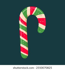 Christmas candy cane with red and green stripes isolated on dark background. 