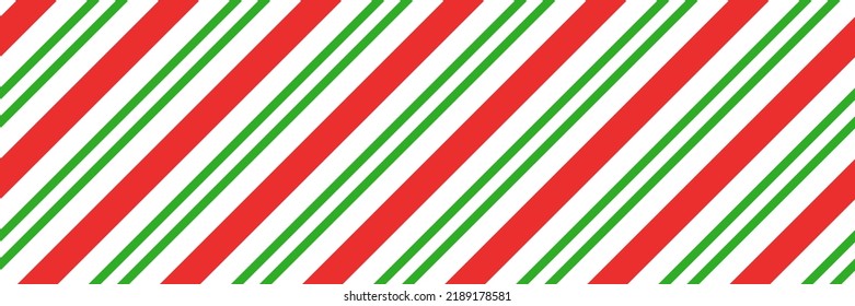 Christmas candy cane striped seamless pattern. Christmas candycane background with red and green stripes. Peppermint caramel diagonal print. Xmas traditional wrapping texture. Vector illustration.
