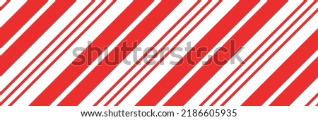 Christmas candy cane striped seamless pattern. Christmas candycane background with red stripes. Caramel diagonal print. Xmas traditional wrapping texture. Vector illustration.