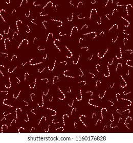Christmas candy canes isolated on a dark red background