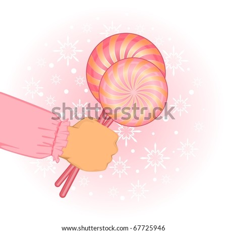 Christmas candy in child hand