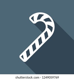 Christmas candy icon, sweet striped lollipop. White flat icon with long shadow on blue background