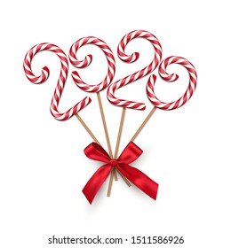 Christmas candy realistic vector illustration. Striped caramel treat shaped in 2020 number. Delicious sweets on sticks with ribbon bow. Xmas banner, festive greeting card decorative 3D design element