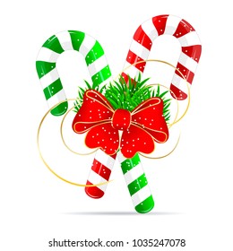 Christmas candy and a red bow-knot on a white background.