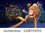 Christmas Card. Christmas background with Santa driving his sleigh and gives presents and gifts. Winter night city in the background. Merry Christmas and Happy New Year