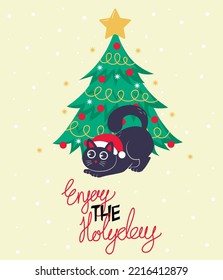 Christmas card, banner or poster template with a Christmas tree and a cute black cat playing under it with the inscription enjoy the holidays