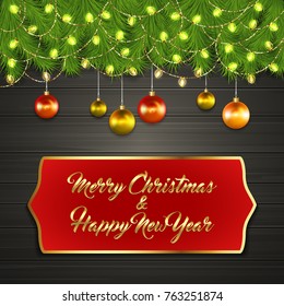 Christmas card with Cristmas fir tree branches on top, glowing garland and Christmas tree balls on black wooden board with greeting text Merry Chrismas and Happy New Year on red label with gold frame