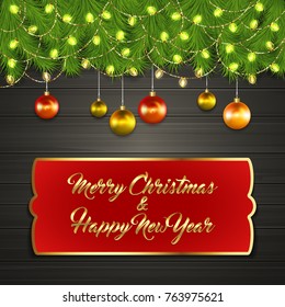 Christmas card with Cristmas fir tree branches on top, glowing garland and Christmas tree balls on black wooden board with greeting text Merry Chrismas and Happy New Year on red label with gold frame