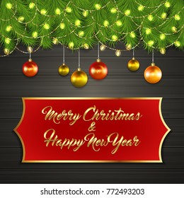 Christmas card with Cristmas fir tree branches on top, glowing garland and Christmas tree balls on black wooden board with greeting text Merry Chrismas and Happy New Year on red label with gold frame