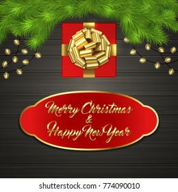 Christmas card with Cristmas fir tree branches, red square gift box with gold ribbon bow, garland on black wooden board. Greeting text Merry Chrismas and Happy New Year on red label with gold frame