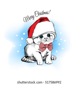 Christmas card. Cute kitten in the red Santa's cap and with striped bow on a blue snow background. Vector illustration.