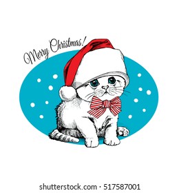 Christmas card. Cute kitten in the red Santa's cap and with striped bow on a blue snow background. Vector illustration.