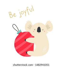 Christmas card with cute koala on decorative ball. Holiday seasons greetings