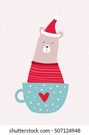 Christmas card with cute santa bear in a cup