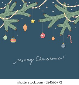 Christmas card. Decorated branches of a Christmas tree on blue background