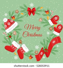 Christmas card with Christmas decorations. Hats, mittens, socks and a scarf. Decorated fir twigs, mandarins, gingerbread and snowflakes.