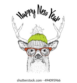 Christmas card with deer in winter hat. Merry Christmas lettering design. Vector illustration
