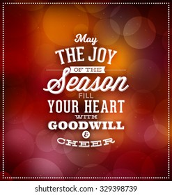 Christmas Card Design - Typographic Greeting - May the Joy of the Season Fill Your Heart with Goodwill and Cheer - Blurred Background with lights