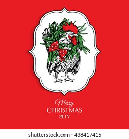 Christmas card featuring the character of the year of the Rooster with a wreath in frame on red background. Vector illustration.