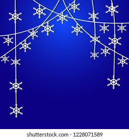 Christmas card with garlands of snowflakes on a blue background