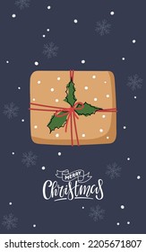 Christmas card with Gift box and handwritten text Merry Christmas. Season greeting. Winter Holiday symbol. Flat vector isolated on dark blue background with snowflakes. Christmas dark Background