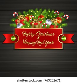 Christmas card with gift boxes with gold ribbon bow, garland, Christmas tree balls, candy sticks, branches of Christmas tree behind red label with greeting text of Merry Christmas and Happy New Year