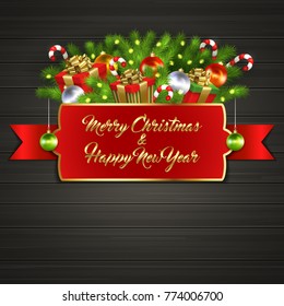 Christmas card with gift boxes with gold ribbon bow, garland, Christmas tree balls, candy sticks, branches of Christmas tree behind red label with greeting text of Merry Christmas and Happy New Year