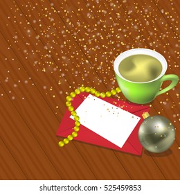 Christmas card with Green cup of coffee or tea on the table dark wood, envelope and space for text. 