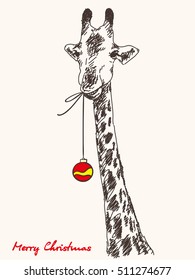 Christmas card hand drawn giraffe with xmas ball hanging from his mouth
