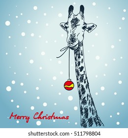 Christmas card hand drawn giraffe with xmas ball hanging from his mouth