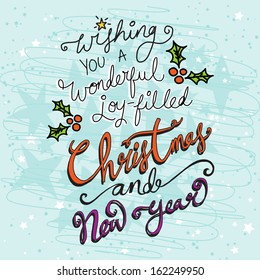 Christmas card with hand drawn text on a turquoise blue textured background saying Wishing you a wonderful joy filled Christmas and New Year