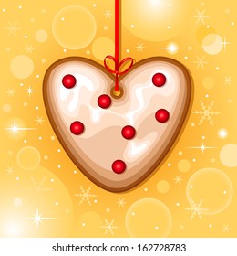 Christmas card with christmas heart cookie hanging with red ribbon