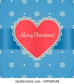Christmas card with heart. Lace label and ribbon on blue grunge background.
