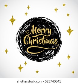 Christmas card. Lettering "Merry Christmas". Vector round black strokes painted by brush. Golden sparkles texture.