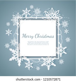 Christmas card with paper snow flake. Falling snowflakes on a dark blue winter background.