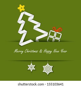 Christmas card with a paper tree on a green background