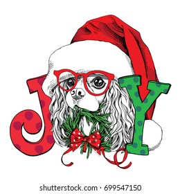 Christmas card. Portrait of a Cavalier King Charles Spaniel in a Santa's cap with a fir wreath and a letters. Vector illustration.