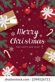 Christmas card with red background with decorative elements of fir branches, gift boxes, Christmas tree balls, striped candy canes for New Year's greetings to family and friends