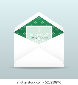Christmas card with snowflake inside open envelope in white and green color