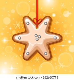 Christmas card with christmas star cookie hanging with red ribbon
