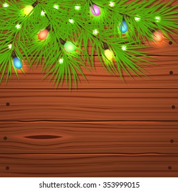 Christmas card with Christmas tree branches and light bulb on wooden background. Vector illustration.